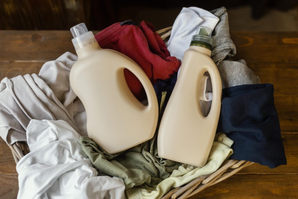 Home top view detergent bottles clothes 1024x683